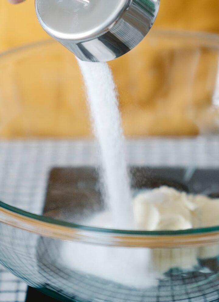 is sugar vegan sugar being poured into a bowl with butter