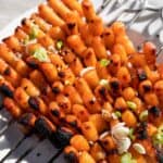 Grilled vegan Tteokbokki on skewers.