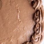 Vegan chocolate buttercream assembled decoratively on a cake.