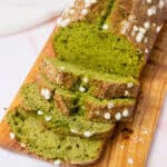 sliced matcha banana bread on a wooden board