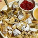 scrambled pancakes served on plate being picked by a fork